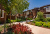 Two story apartment buildings with balconies staircase to upper units